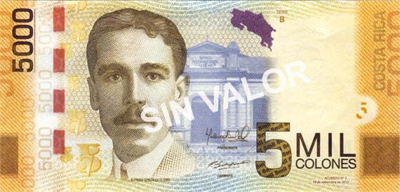 Billete de ₡5.000 del Banco Central de Costa Rica con el retrato de Alfredo González Flores, acompañado de elementos arquitectónicos y culturales representativos del patrimonio nacional.