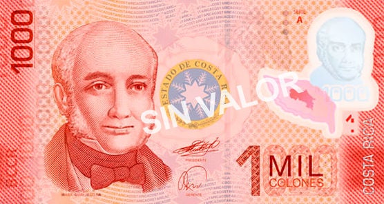 Billete de ₡1.000 colones de Costa Rica en tonos rojizos, con retrato en el anverso, elementos de seguridad y la denominación “1 mil colones”; la imagen incluye la marca diagonal “sin valor”.