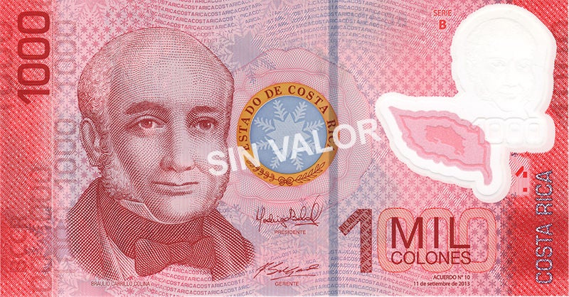 Anverso del billete de ₡1.000 colones de Costa Rica, en tonos rojizos, con el retrato de Braulio Carrillo Colina, elementos de seguridad y la denominación “1 mil colones”; la imagen muestra además la marca diagonal “sin valor”.