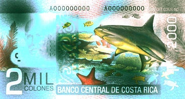 Discolored ₡2,000 banknote with darkened and faded areas affecting its appearance.