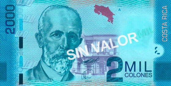 Billete de ₡2.000 del Banco Central de Costa Rica con el retrato de Mauro Fernández Acuña, acompañado de referencias al patrimonio arquitectónico y cultural del país.