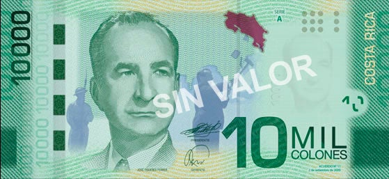Billete de ₡10.000 del Banco Central de Costa Rica con el retrato de José Figueres Ferrer y elementos gráficos que resaltan la identidad nacional y el desarrollo social del país.