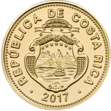 Reverse of a gold-colored Costa Rican coin. At the center is the national coat of arms in relief, surrounded by the inscription “REPÚBLICA DE COSTA RICA” along the outer edge. The year 2017 appears at the bottom. The coin features a circular gold-colored design with engraved details of the national coat of arms and a border decorated with small raised marks around the entire circumference.